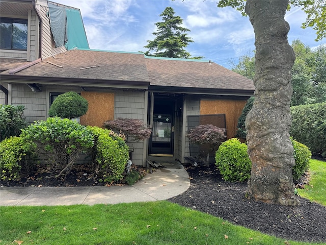 1 Stanford Ct Unit 1, Wantagh, NY 11793 - view of exterior entry featuring roof with shingles