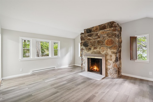 45 Juniper Dr, Lincolndale, NY 10541 - unfurnished living room featuring a baseboard heating unit, lofted ceiling, a fireplace, and wood finished floors