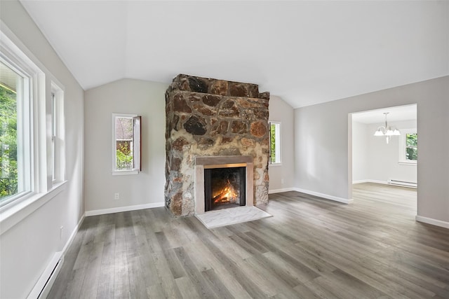 45 Juniper Dr, Lincolndale, NY 10541 - unfurnished living room featuring baseboard heating, a fireplace, lofted ceiling, wood finished floors, and a chandelier