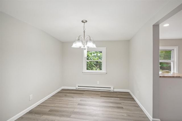 45 Juniper Dr, Lincolndale, NY 10541 - spare room featuring a baseboard radiator, a chandelier, light wood-type flooring, and recessed lighting