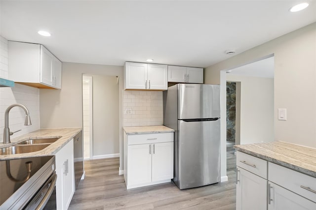 45 Juniper Dr, Lincolndale, NY 10541 - kitchen featuring stainless steel appliances, white cabinetry, tasteful backsplash, light wood-type flooring, and recessed lighting