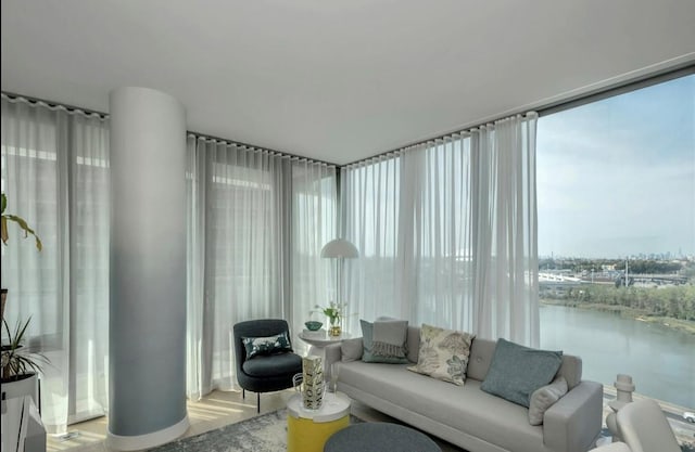 131-01 40th Rd Unit 11N, Flushing, NY 11354 - living room featuring wood finished floors, a water view, and floor to ceiling windows