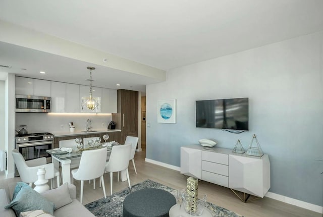 131-01 40th Rd Unit 11N, Flushing, NY 11354 - living room with light wood-style flooring and recessed lighting
