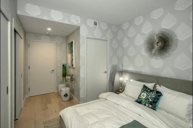 131-01 40th Rd Unit 11N, Flushing, NY 11354 - bedroom featuring wallpapered walls and wood finished floors
