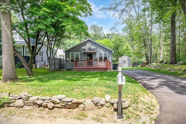 3 Preston Pl, Patterson, NY 12563 - view of front facade featuring a deck and asphalt driveway