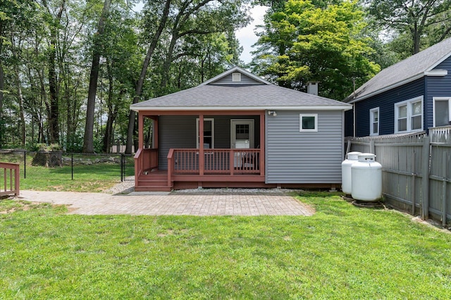 3 Preston Pl, Patterson, NY 12563 - rear view of house featuring roof with shingles, a fenced backyard, a patio area, a deck, and view of wooded area