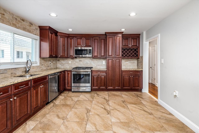160-46 84th St, Howard Beach, NY 11414 - kitchen with stainless steel appliances, backsplash, recessed lighting, dark brown cabinets, and light stone countertops