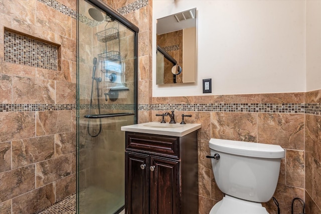 160-46 84th St, Howard Beach, NY 11414 - full bathroom featuring tile walls, a stall shower, vanity, and a wainscoted wall