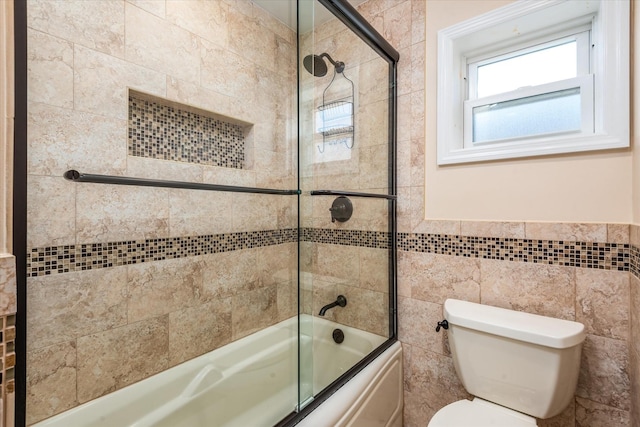 160-46 84th St, Howard Beach, NY 11414 - bathroom featuring combined bath / shower with glass door and tile walls
