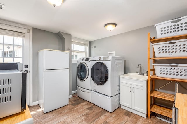 160-46 84th St, Howard Beach, NY 11414 - washroom featuring washing machine and dryer and light wood finished floors