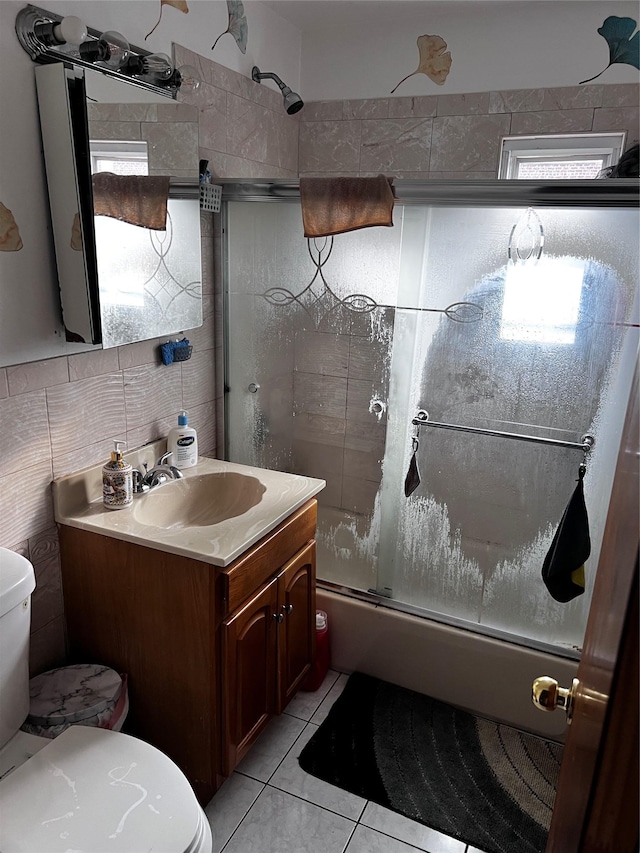 4153 Bruner Ave, Bronx, NY 10466 - full bath featuring bath / shower combo with glass door, vanity, tile patterned flooring, tile walls, and decorative backsplash