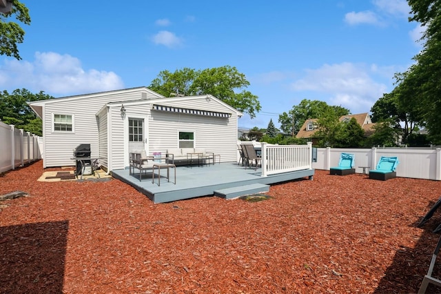3300 Walters Ave, Wantagh, NY 11793 - rear view of house featuring a deck, a fenced backyard, and an outdoor living space
