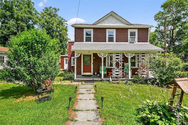 63 Orange St, Port Jervis, NY 12771 - view of front of house with a porch, a front yard, and a shingled roof