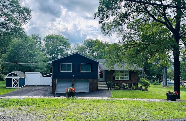 27 W Ave, Putnam Valley, NY 10579 - split level home featuring an attached garage, a storage shed, a front yard, brick siding, and driveway