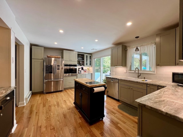 27 W Ave, Putnam Valley, NY 10579 - kitchen featuring stainless steel appliances, tasteful backsplash, light wood-style floors, recessed lighting, and a kitchen island