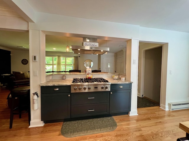 27 W Ave, Putnam Valley, NY 10579 - kitchen with stainless steel gas stovetop, wall chimney exhaust hood, baseboard heating, and light wood finished floors