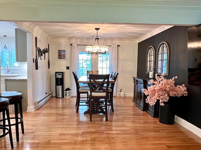 27 W Ave, Putnam Valley, NY 10579 - dining space featuring a baseboard radiator, a chandelier, ornamental molding, and light wood-type flooring