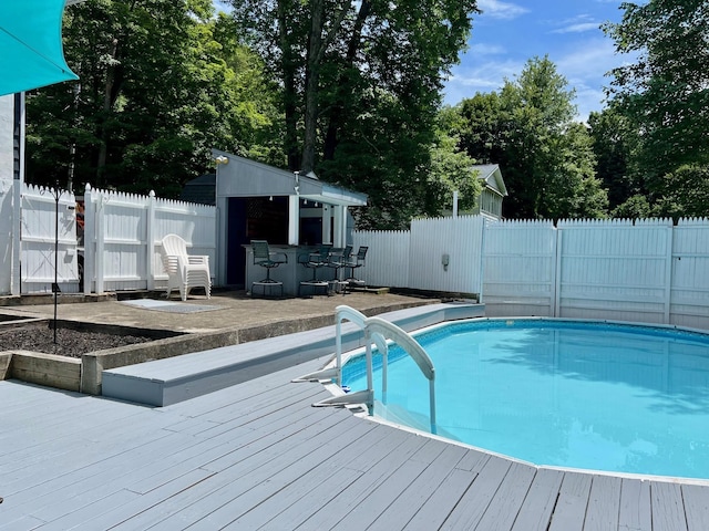 27 W Ave, Putnam Valley, NY 10579 - view of pool featuring a deck, a fenced backyard, and view of wooded area