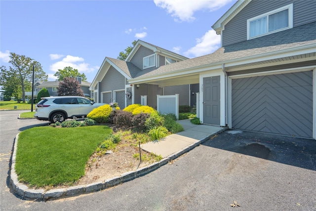 365 Seabreeze Ct, Moriches, NY 11955 - view of home's exterior featuring a shingled roof, driveway, and an attached garage