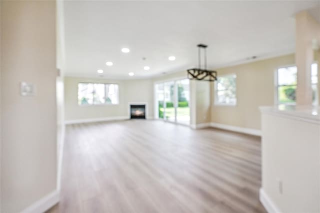 365 Seabreeze Ct, Moriches, NY 11955 - unfurnished living room featuring light wood-style floors, a fireplace, and recessed lighting