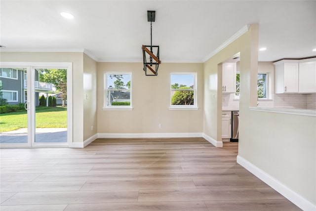365 Seabreeze Ct, Moriches, NY 11955 - unfurnished dining area featuring healthy amount of natural light, ornamental molding, light wood-type flooring, and recessed lighting