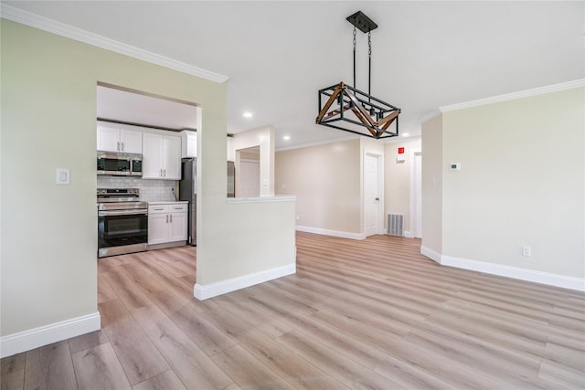 365 Seabreeze Ct, Moriches, NY 11955 - kitchen with appliances with stainless steel finishes, a chandelier, white cabinets, open floor plan, and light wood-type flooring