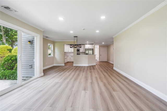 365 Seabreeze Ct, Moriches, NY 11955 - unfurnished living room featuring ornamental molding, light wood-style floors, and recessed lighting