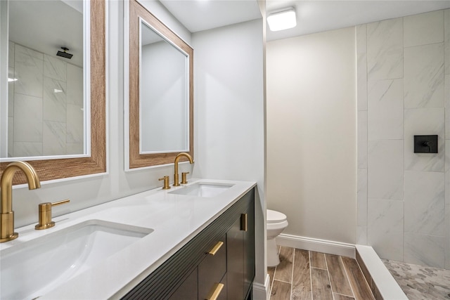365 Seabreeze Ct, Moriches, NY 11955 - bathroom featuring double vanity, wood finish floors, and a tile shower