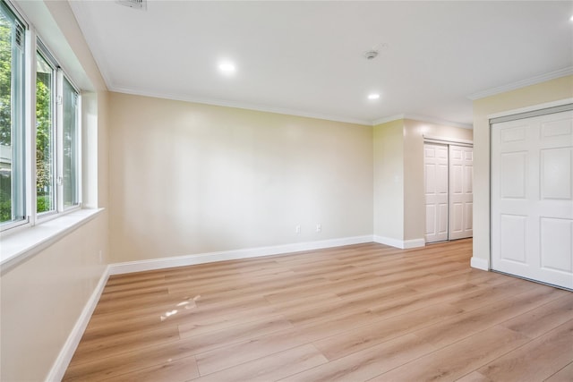 365 Seabreeze Ct, Moriches, NY 11955 - unfurnished bedroom featuring multiple windows, light wood-style flooring, recessed lighting, and ornamental molding