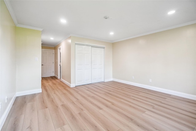 365 Seabreeze Ct, Moriches, NY 11955 - unfurnished bedroom featuring a closet, recessed lighting, crown molding, and light wood-type flooring