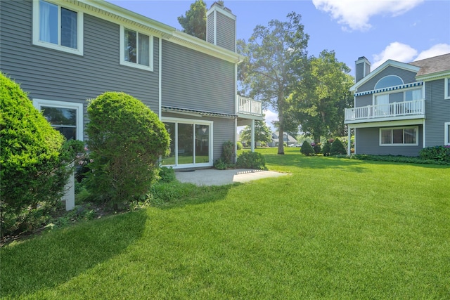 365 Seabreeze Ct, Moriches, NY 11955 - view of green lawn with a patio area and a balcony