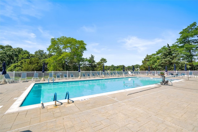 365 Seabreeze Ct, Moriches, NY 11955 - community pool featuring a patio and view of wooded area