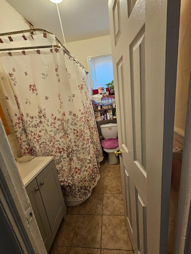 4439 Carpenter Ave, Bronx, NY 10470 - full bath with vanity, tile patterned floors, and a shower with shower curtain
