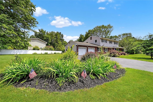 28 Lapin Ln, Blauvelt, NY 10913 - view of front facade featuring an attached garage and driveway