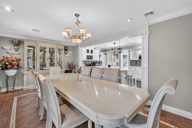 28 Lapin Ln, Blauvelt, NY 10913 - dining space with a chandelier, dark wood-style flooring, crown molding, and recessed lighting