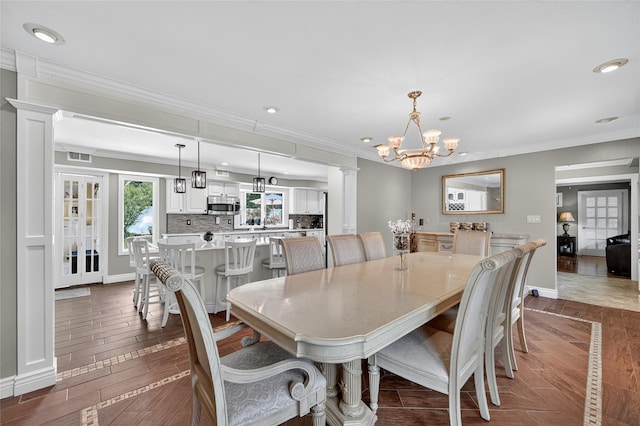 28 Lapin Ln, Blauvelt, NY 10913 - dining space with a chandelier, decorative columns, recessed lighting, dark wood-style floors, and ornamental molding
