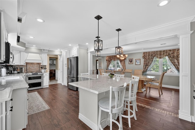 28 Lapin Ln, Blauvelt, NY 10913 - kitchen with appliances with stainless steel finishes, white cabinets, backsplash, ornate columns, and crown molding