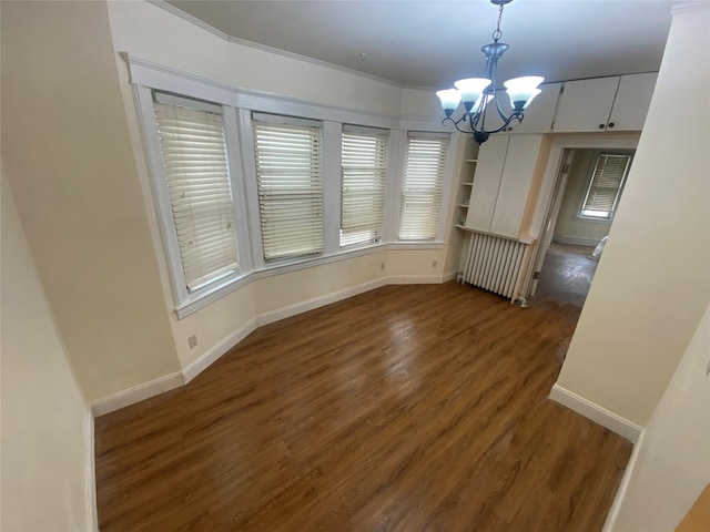 15 Grant St, Yonkers, NY 10704 - unfurnished dining area with radiator, a chandelier, and wood finished floors