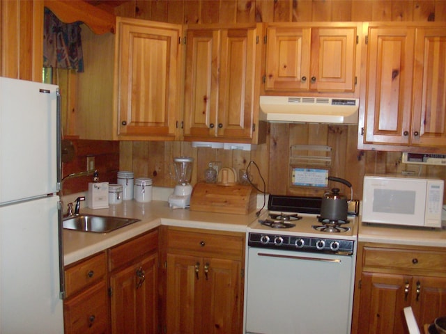 1460 Old Rte 17, Roscoe, NY 12776 - kitchen featuring white appliances, under cabinet range hood, light countertops, and brown cabinets