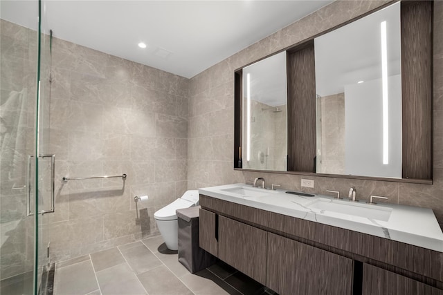 133-36 37th Ave Unit 10, Flushing, NY 11354 - full bath featuring tile walls, double vanity, a shower stall, and tile patterned floors