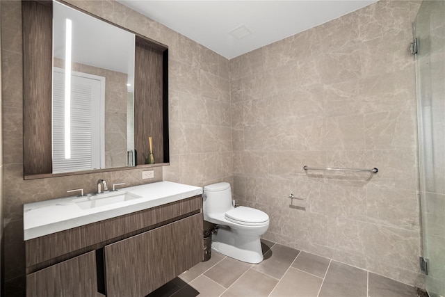 133-36 37th Ave Unit 10, Flushing, NY 11354 - full bathroom featuring tile walls, vanity, a stall shower, and tile patterned floors