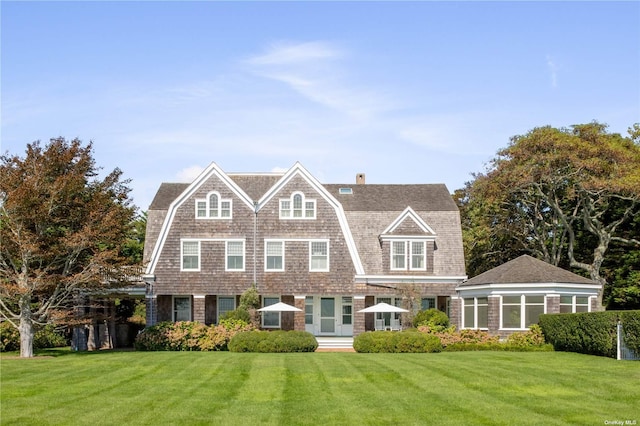 12120 New Suffolk Ave, Cutchogue, NY 11935 - rear view of property with a gambrel roof, a yard, and a chimney