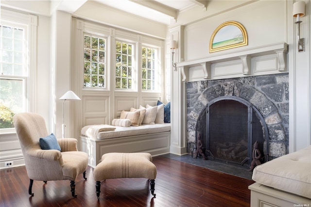 12120 New Suffolk Ave, Cutchogue, NY 11935 - sitting room with healthy amount of natural light, dark wood-type flooring, and a premium fireplace