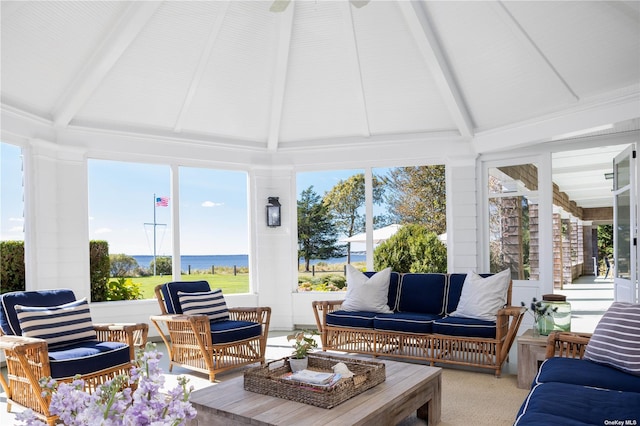 12120 New Suffolk Ave, Cutchogue, NY 11935 - sunroom / solarium with beamed ceiling, carpet floors, high vaulted ceiling, and a water view