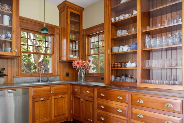 12120 New Suffolk Ave, Cutchogue, NY 11935 - kitchen featuring stainless steel dishwasher, brown cabinetry, decorative light fixtures, and plenty of natural light