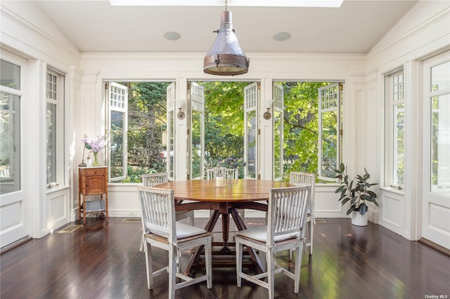 12120 New Suffolk Ave, Cutchogue, NY 11935 - sunroom featuring a decorative wall, wood-type flooring, and vaulted ceiling