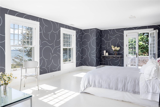 12120 New Suffolk Ave, Cutchogue, NY 11935 - bedroom with wallpapered walls and access to outside