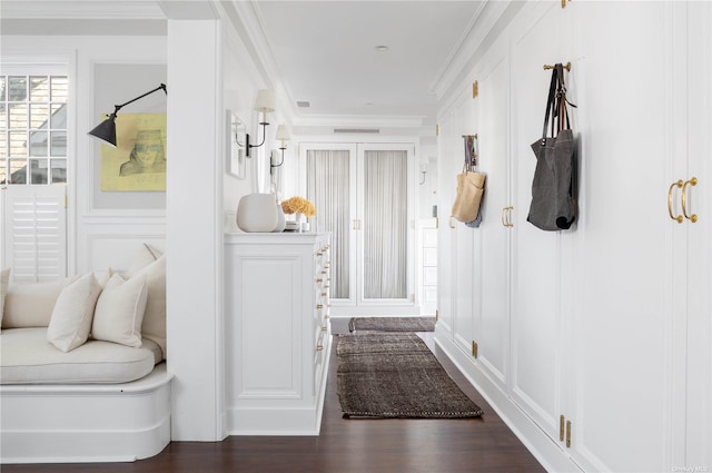 12120 New Suffolk Ave, Cutchogue, NY 11935 - hallway featuring a decorative wall, dark wood-style flooring, and crown molding