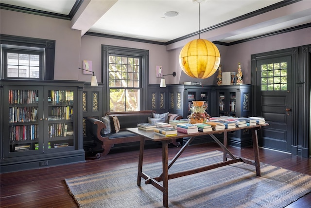 12120 New Suffolk Ave, Cutchogue, NY 11935 - dining area featuring ornamental molding, wood finished floors, a decorative wall, and wainscoting