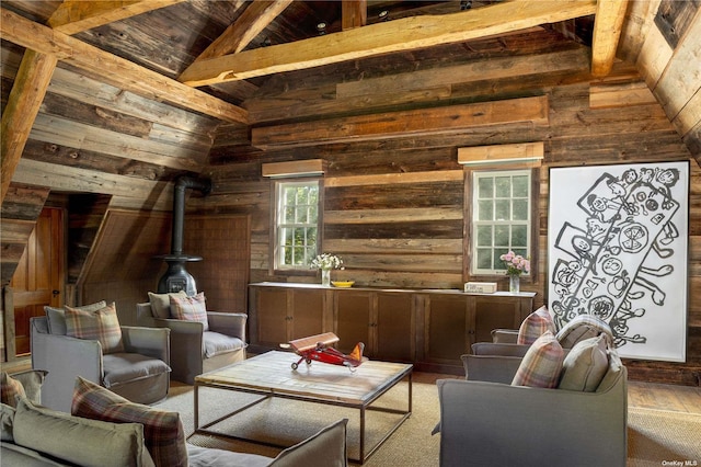 12120 New Suffolk Ave, Cutchogue, NY 11935 - living area with wood walls, a wood stove, a wood ceiling with exposed beams, high vaulted ceiling, and wood finished floors